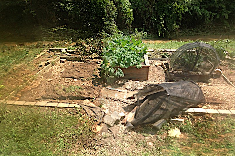 Destruction of the garden on the 
		morning after the flood of 2026